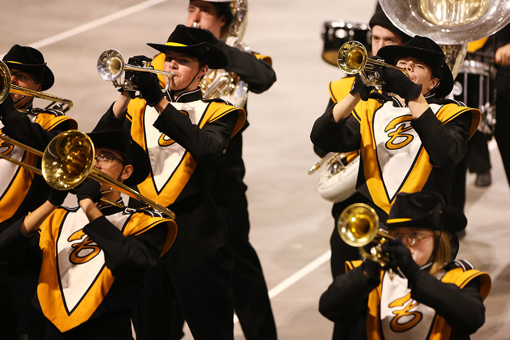 Trumpet soloist Gabriel Cahhal-Laudert, right, joins the brass section
